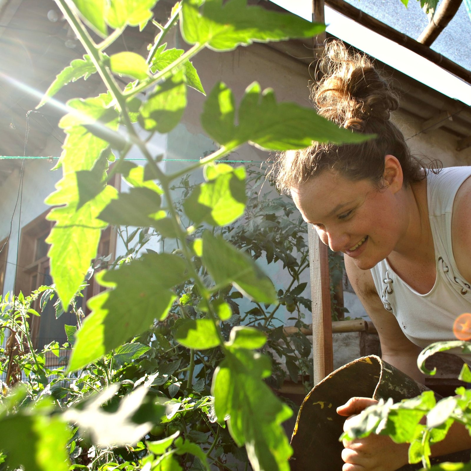 A volunteer works in the garden